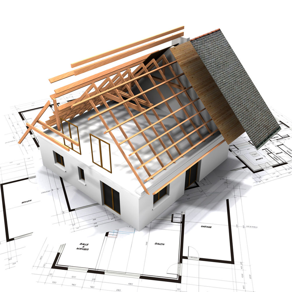 Maquette de maison sur des plans d'architecte